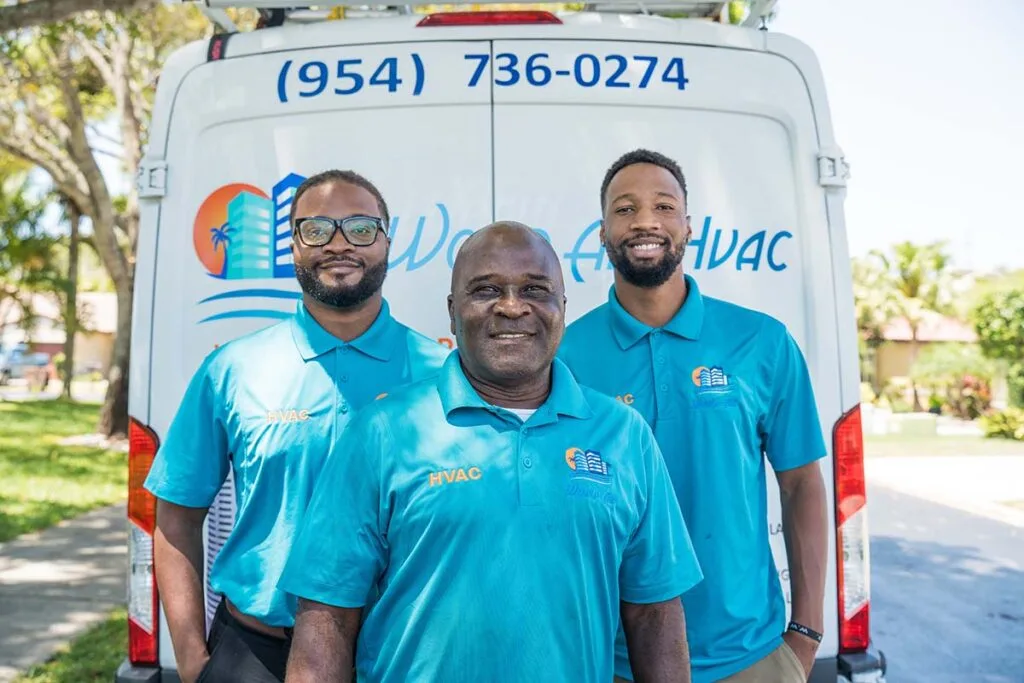 World Air HVAC team installing a new AC system in Broward County