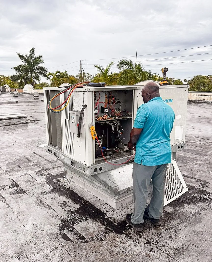 World Air HVAC technician in branded service van, ready for call in Broward County