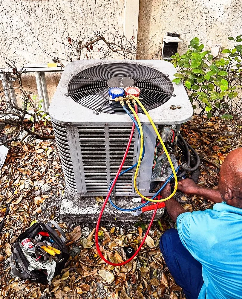 World Air HVAC technician diagnosing Daikin commercial HVAC electrical panel